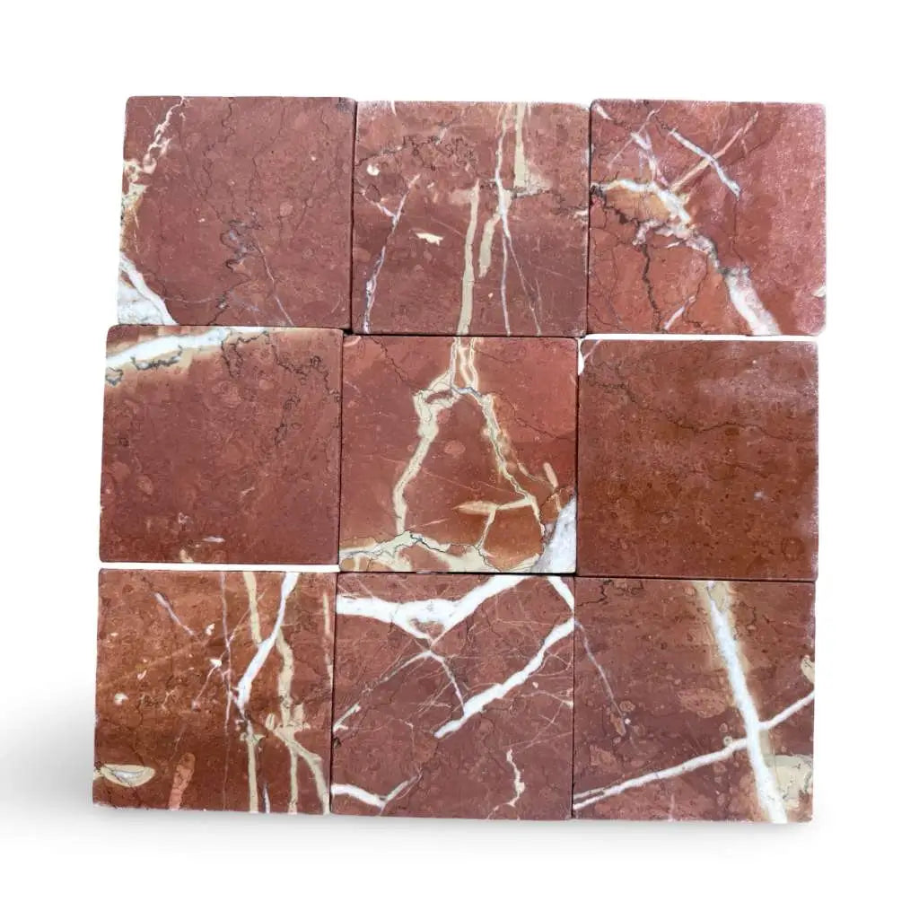 Nine square Rojo Alicante 4X4 tumbled red marble tiles with white and beige veining