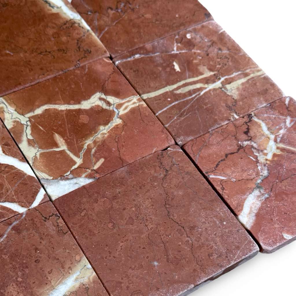 Red marble tiles with white and gold veining for Rojo Alicante 4X4 Tumbled product display