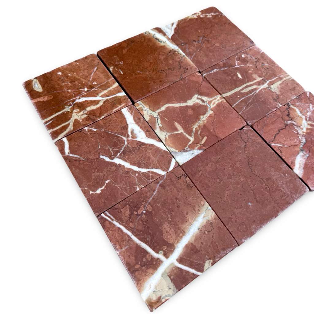 Red marble tiles with white veining from Rojo Alicante 4X4 Tumbled collection