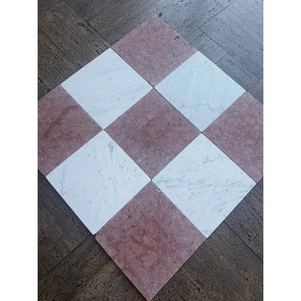 Checkerboard pattern of pink and white marble tiles from Rojo Alicante Marble 12x12 Tumbled