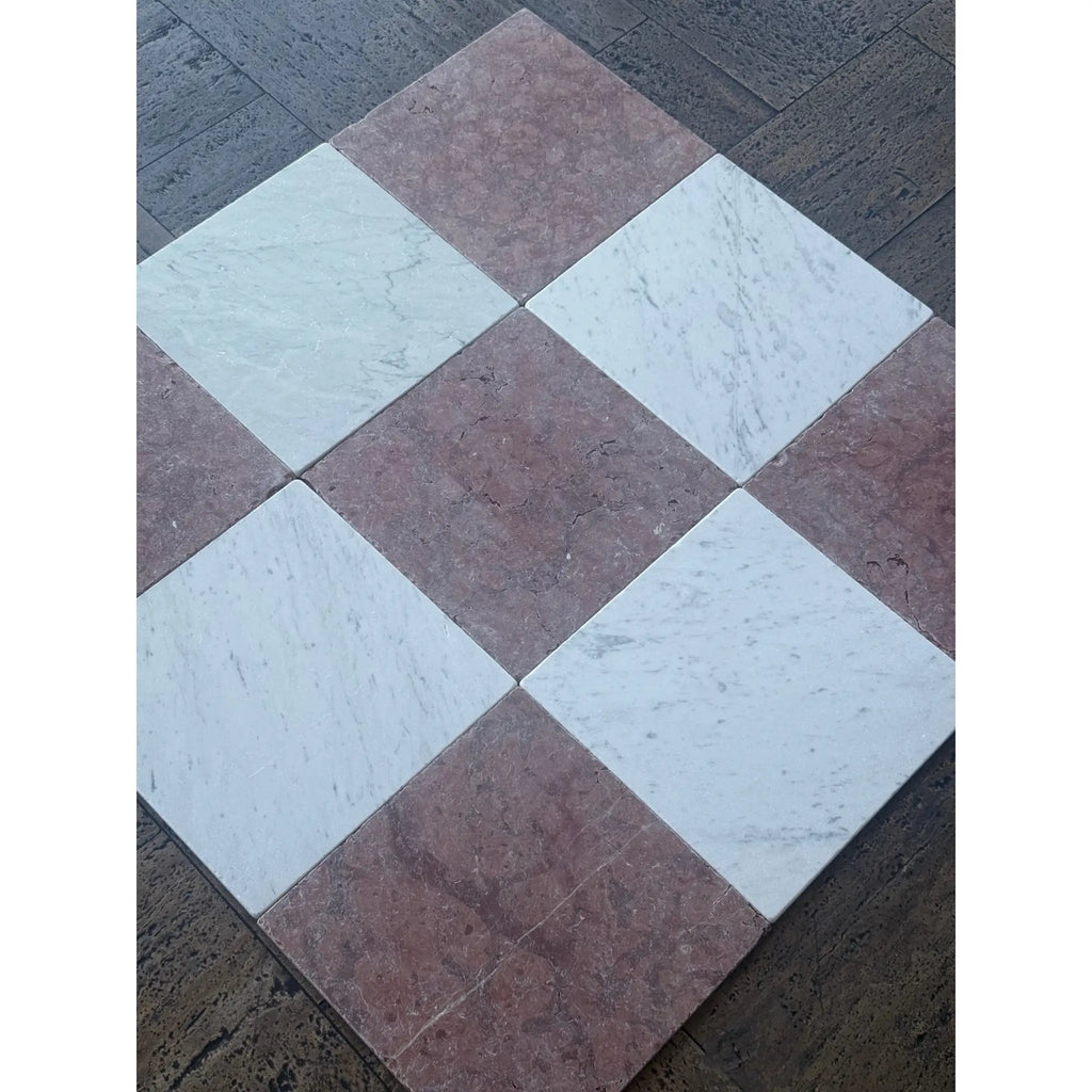 Red and white marble tiles arranged in an alternating pattern for Rojo Alicante Marble 12X12 Tumbled