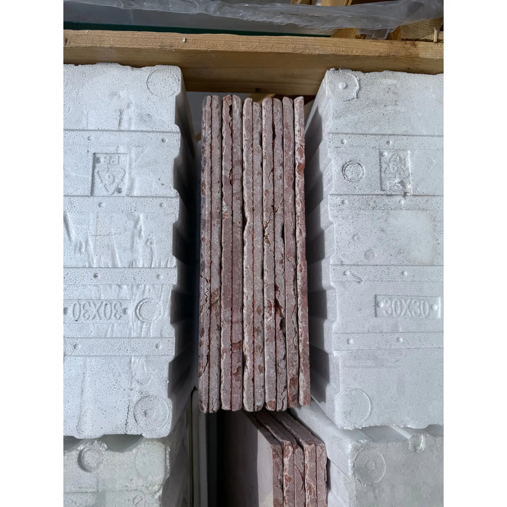 Stacked red stone tiles showcasing Rojo Alicante Marble 12X12 Tumbled collection