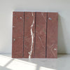 Red marble tiles with white veining showcasing Rojo Alicante Marble 3 X 12 Field Tile