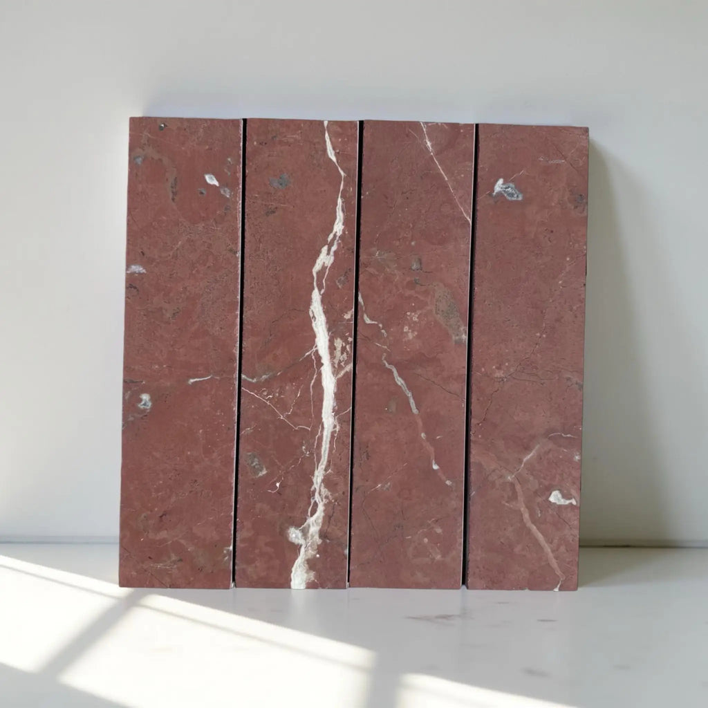 Red marble tiles with white veining showcasing Rojo Alicante Marble 3 X 12 Field Tile
