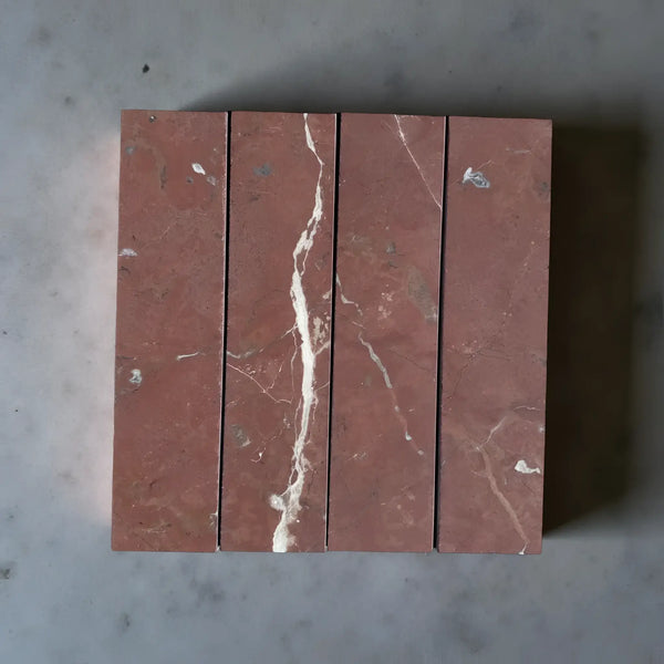 Red marble tiles with white veining in Rojo Alicante Marble 3 X 12 Field Tile