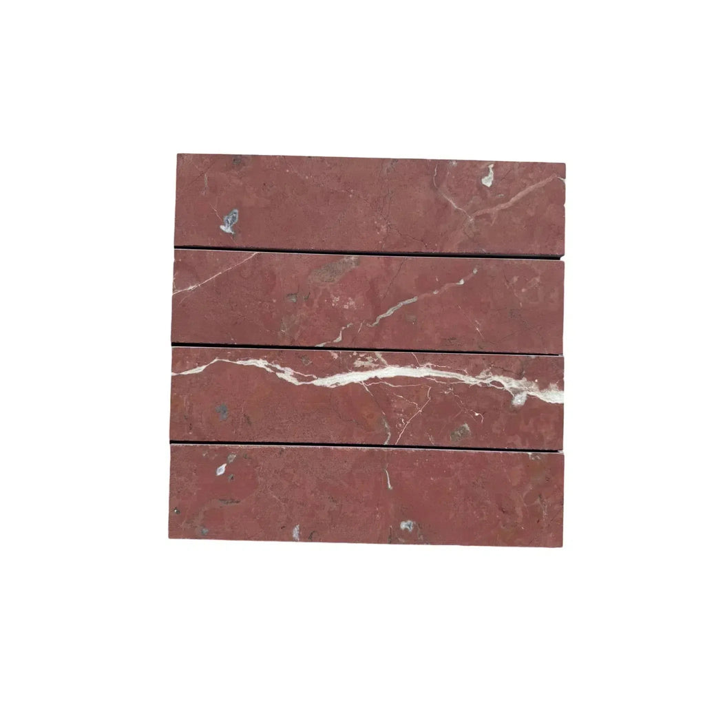 Stacked red marble tiles of Rojo Alicante Marble 3 X 12 Field Tile display