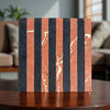 Striped marble block of Rojo Alicante and Nero Marquina in a mosaic design