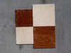 Four Rojo Alicante Rustic Modern Tumbled marble tiles in reddish-brown and off-white