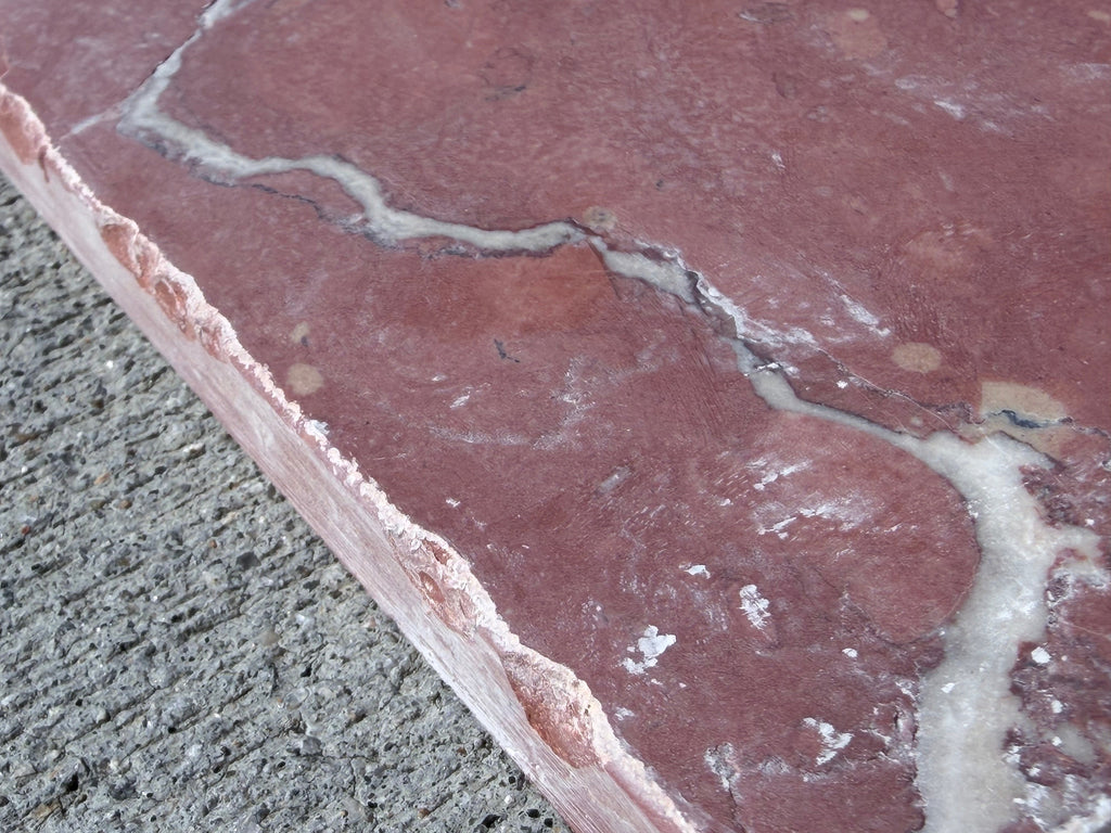 Rojo Alicante Rustic Modern Tumbled reddish-pink stone slab with white veining