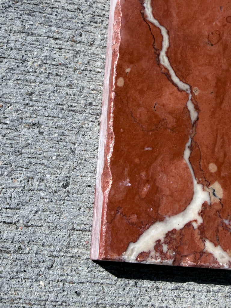 Rojo Alicante Rustic Modern Tumbled red marble slab with white veining