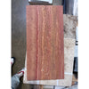 A rectangular slab of rojo red vein-cut travertine stone with natural wavy veining and a polished honed surface