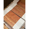 Stacked reddish-brown travertine tiles with natural veining for Rojo Red Vein-Cut Travertine