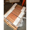 Stacked orange and red travertine tiles with natural bands, secured with white strapping
