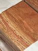 Stacked red and beige travertine tiles with a banded pattern for Rojo Red Vein-Cut Travertine