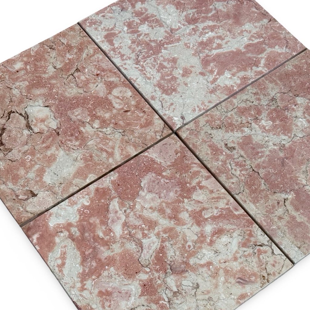 Four pink and gray marble tiles with a mottled pattern for Rosé Aurora Marble 12X12 Polished
