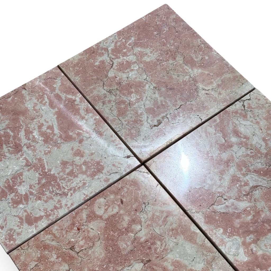 Four pink and grey marble tiles with natural veining for Rosé Aurora Marble 12X12 Polished