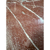 Highly polished Rosso Laguna Marble surface with white and grey veining