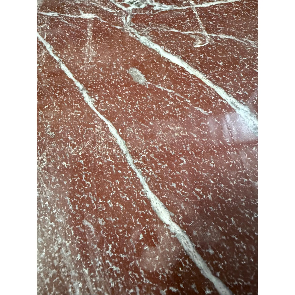 Highly polished Rosso Laguna Marble surface with white and grey veining