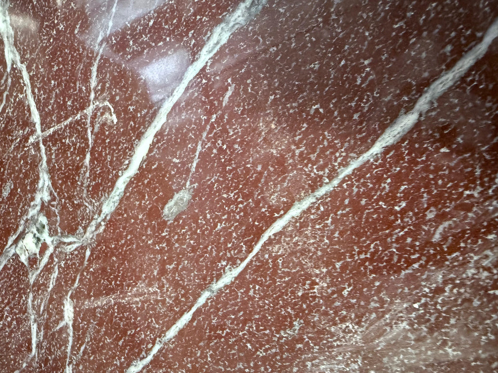 Polished Rosso Laguna Marble with red, white, and light green veining