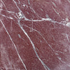 Red marble slab with white and gray veining from Rosso Laguna Marble collection