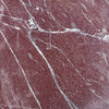 Red marble slab with white and gray veining from Rosso Laguna Marble collection