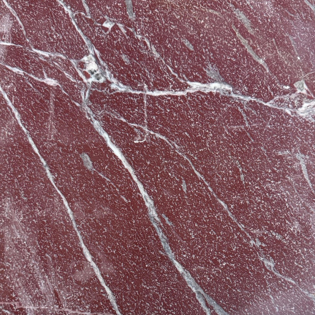 Red marble slab with white and gray veining from Rosso Laguna Marble collection