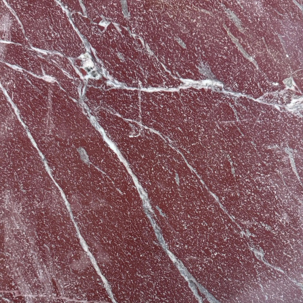 Red marble slab with white and gray veining from Rosso Laguna Marble collection