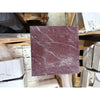 Square Rosso Laguna Marble tile with reddish-purple color and prominent white gray veining