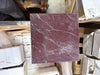 Square Rosso Laguna Marble tile with reddish-purple color and prominent white gray veining