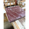 Polished Dark Red Rosso Laguna Marble tiles with white veins stacked neatly