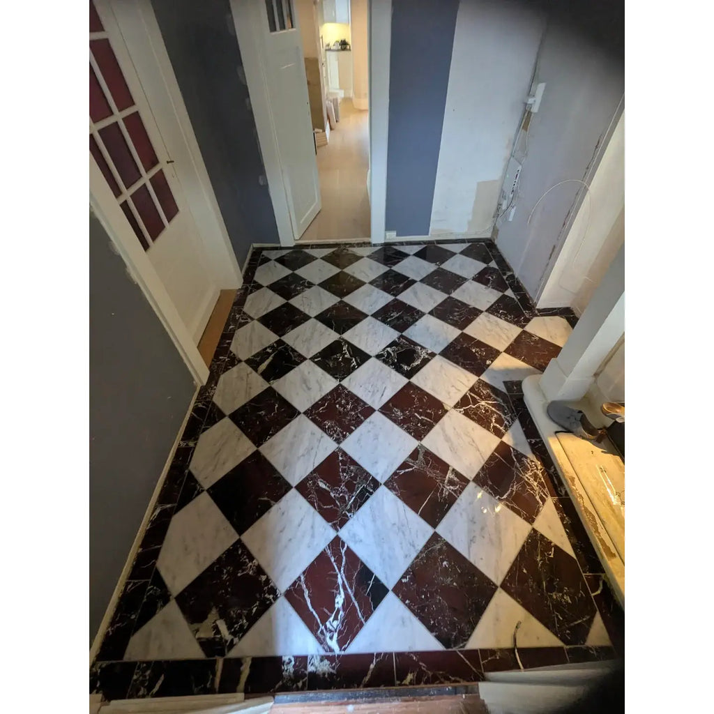 Rosso levanto breccia vino marble 12x12 polished black and white tiles arranged in a diamond pattern