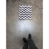 A rectangular polished-honed herringbone mosaic marble panel featuring a bold zigzag pattern in rosso levanto and italian statuary colors