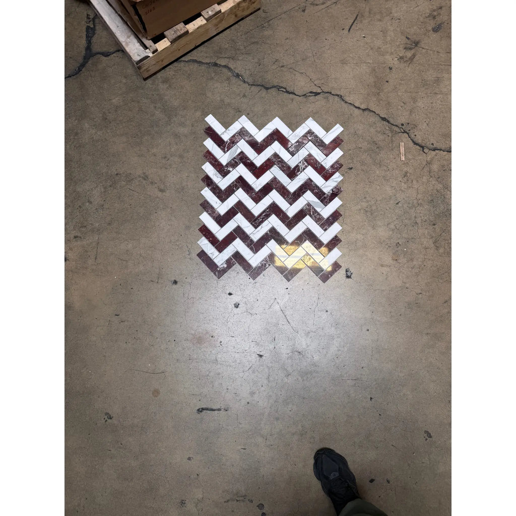 A rectangular polished-honed marble mosaic panel with rosso levanto and italian statuary zigzag pattern