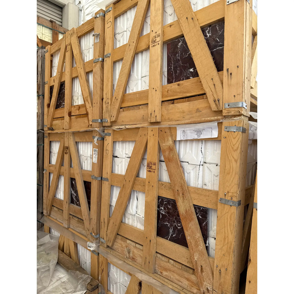 Wooden crates filled with Rosso Levanto Marble 12X12 Polished tiles