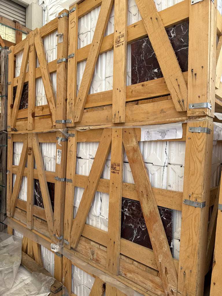 Wooden crates filled with Rosso Levanto Marble 12X12 Polished tiles