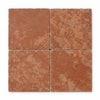 Four square 12x12 rosso verona marble tiles with rustic tumbled texture and warm reddish-brown tones
