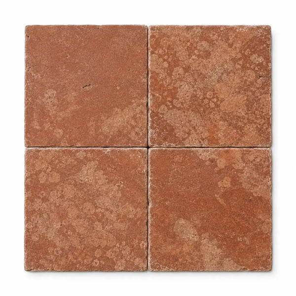 Four square 12x12 rosso verona marble tiles with rustic tumbled texture and warm reddish-brown tones