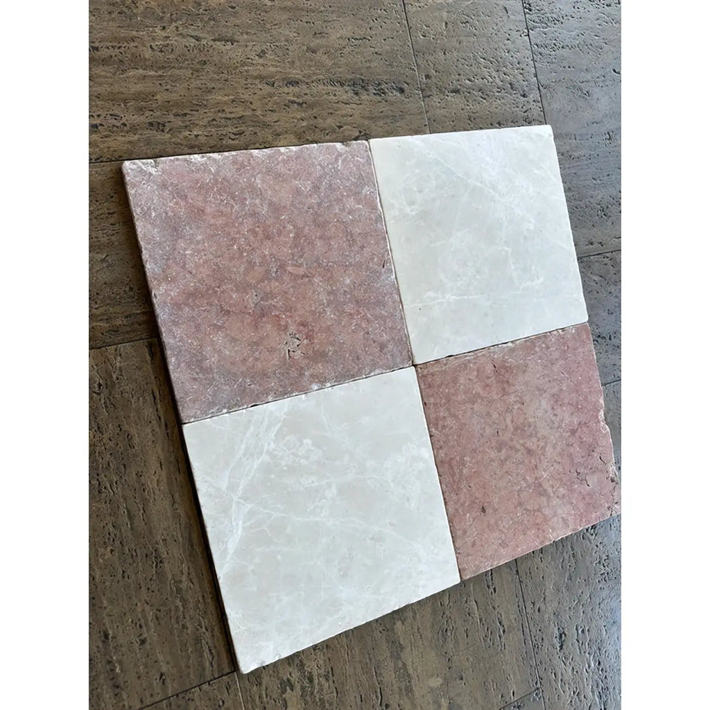 Four square rosso verona marble 12x12 tumbled tiles in soft pink with veining and creamy white marble texture arranged diagonally