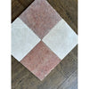 Four rosso verona marble 12x12 tumbled tiles in a diamond pattern with pink and white veined surfaces