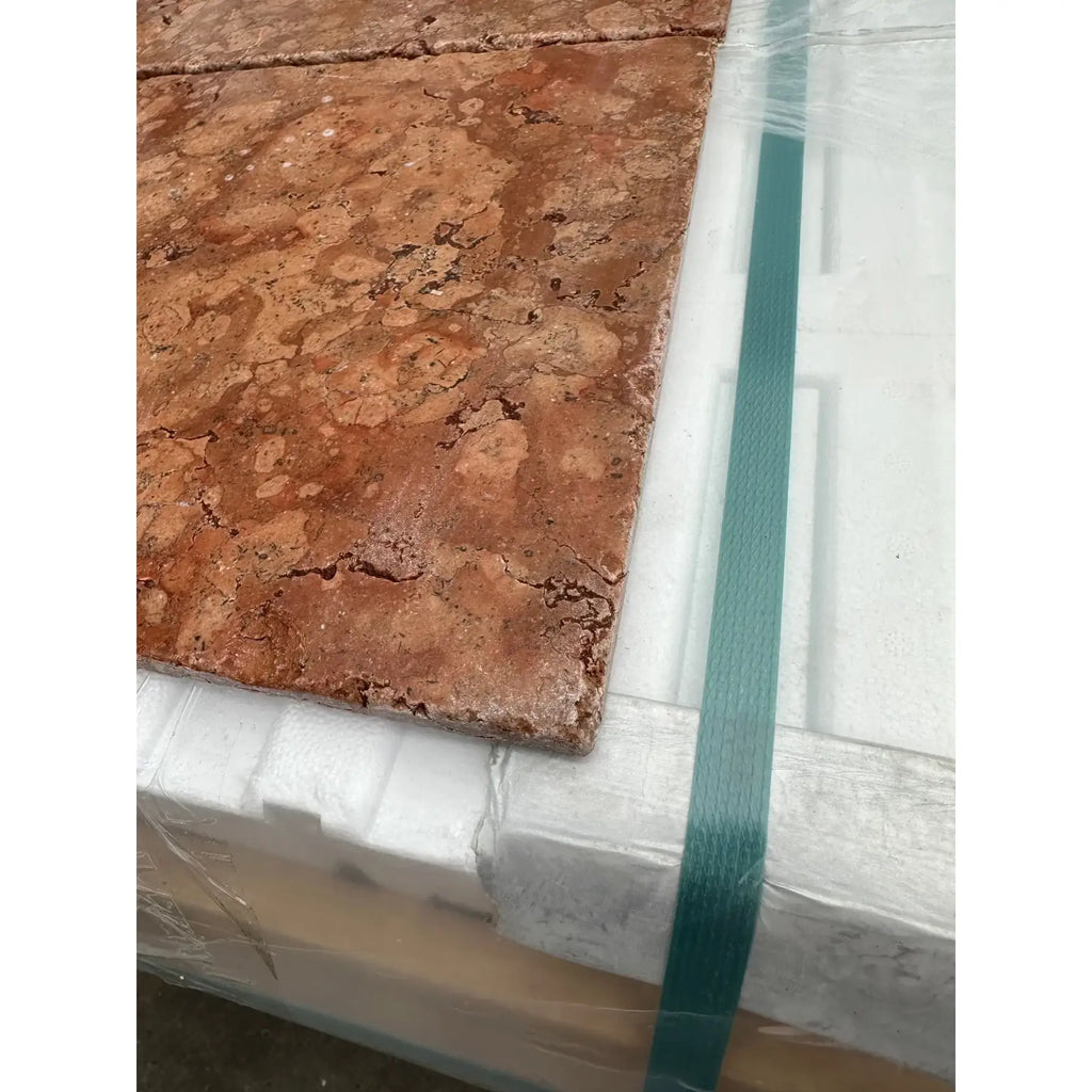 Rosso Verona marble 12x12 tumbled tile in rustic reddish brown with a natural cracked stone surface texture