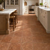 Warm terracotta colored rosso verona marble 12x12 tumbled ceramic floor tiles with rustic textured finish