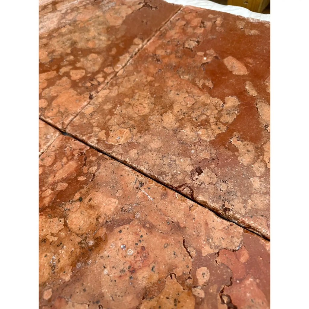 Rosso Verona marble 12x12 tumbled terracotta tiles with mottled earthy red-brown surface and visible cracks