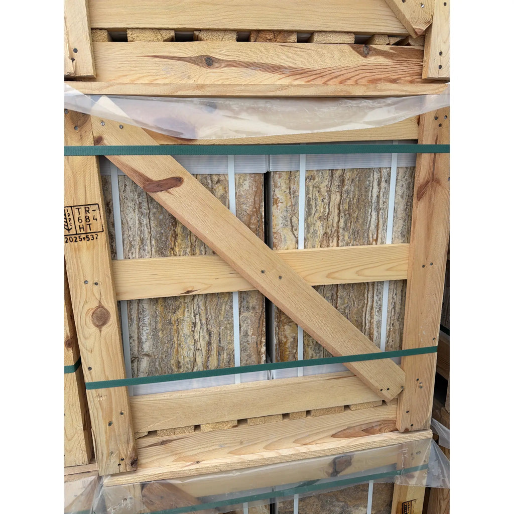Scabos Autumn Leaves Travertine slabs in light wooden crate with green straps