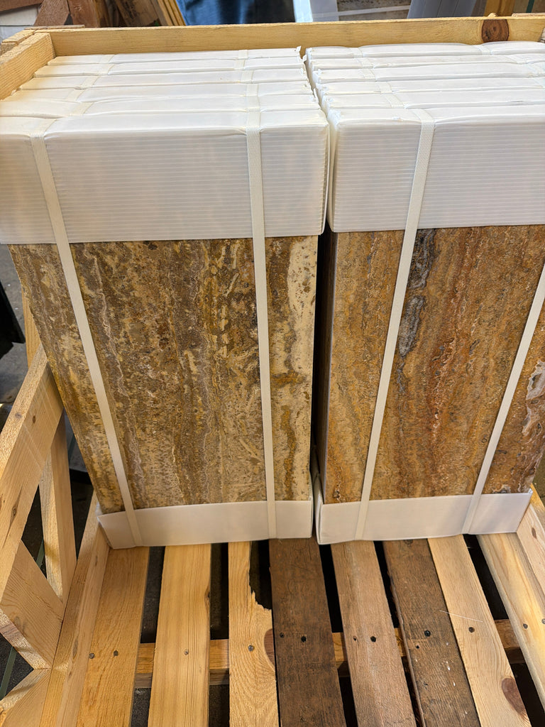 Scabos Autumn Leaves Travertine 12x24 stacked beige gold-veined tiles wrapped in white