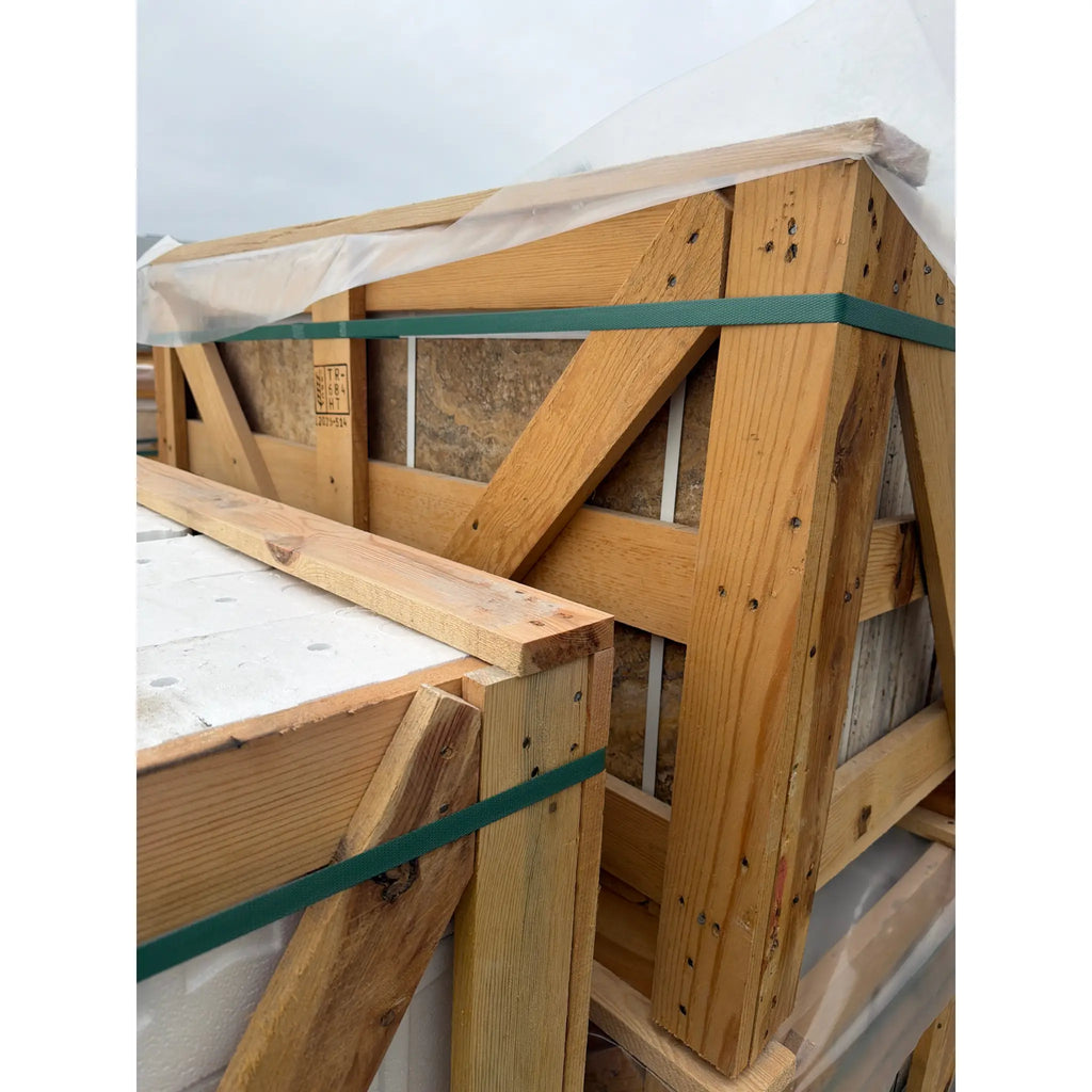 Scabos Autumn Leaves Travertine 18x18 crate with green straps and plastic wrap