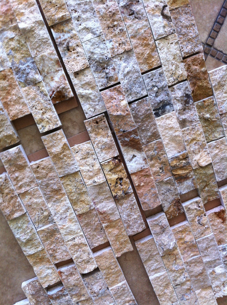 Natural rough-textured multi-toned Travertine tile with varying rectangular pieces
