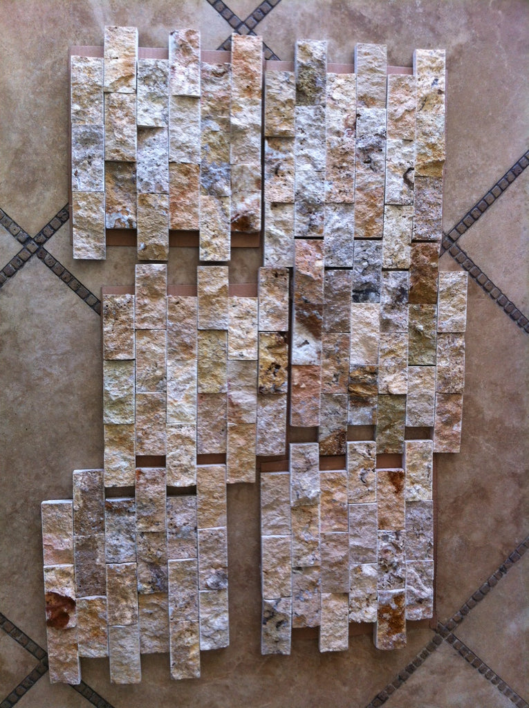 Textured natural stone mosaic tiles in beige, brown, and grey arranged vertically