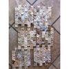 Four sheets of earthy-toned natural stone mosaic tiles from Scabos Autumn Leaves Travertine collection