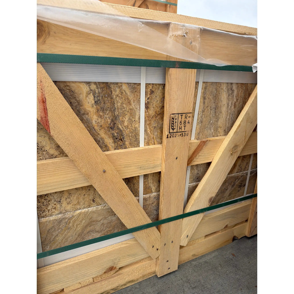 Scabos Autumn Leaves Travertine Versailles set in sturdy wooden crate with green straps