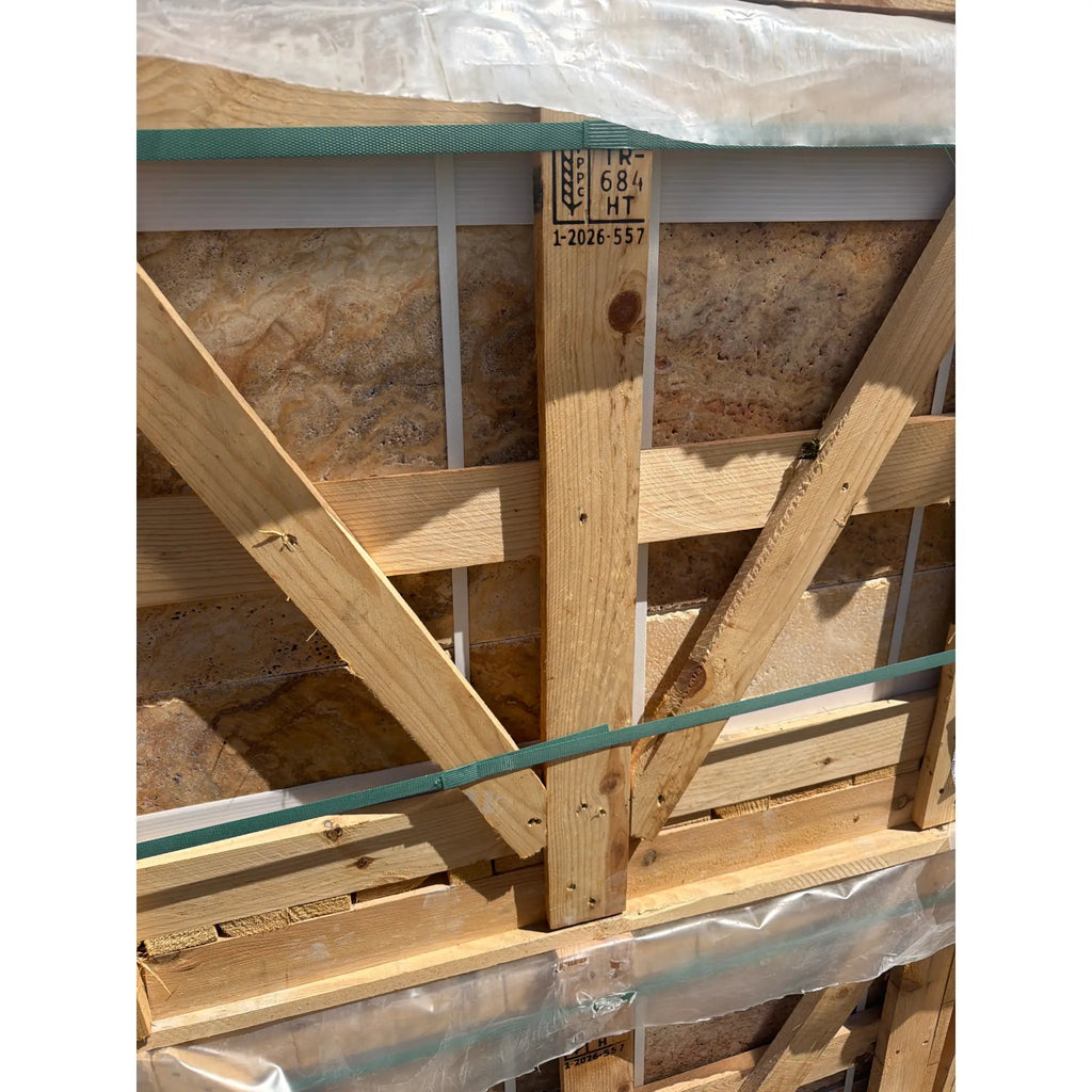 Light-colored wooden structural beam with visible grain and knots secured by green mesh tape in scabos autumn leaves travertine set